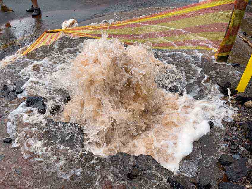 Gushing water from a burst pipe