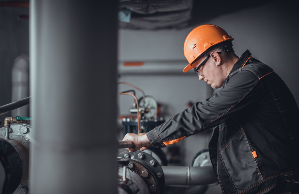 plumber engineer repairing pipes at work