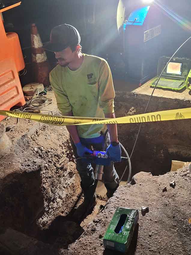 Technician performing pipe reinstatement